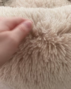 Close-up of the deep oat plush pile of the DenKind Calm Bed