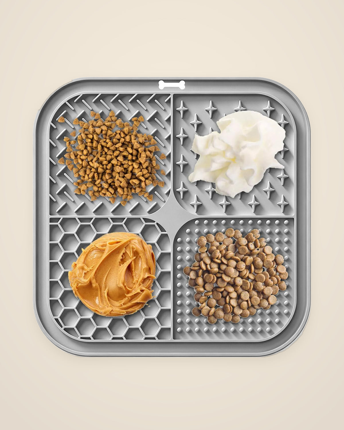 The DenKind Lick Mat with food spread across its four textured sections