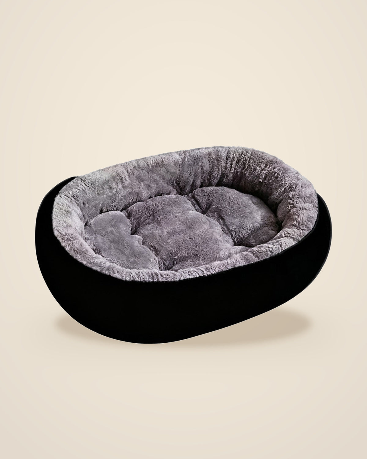 The DenKind Calm Bed Oval in charcoal with a grey plush lining