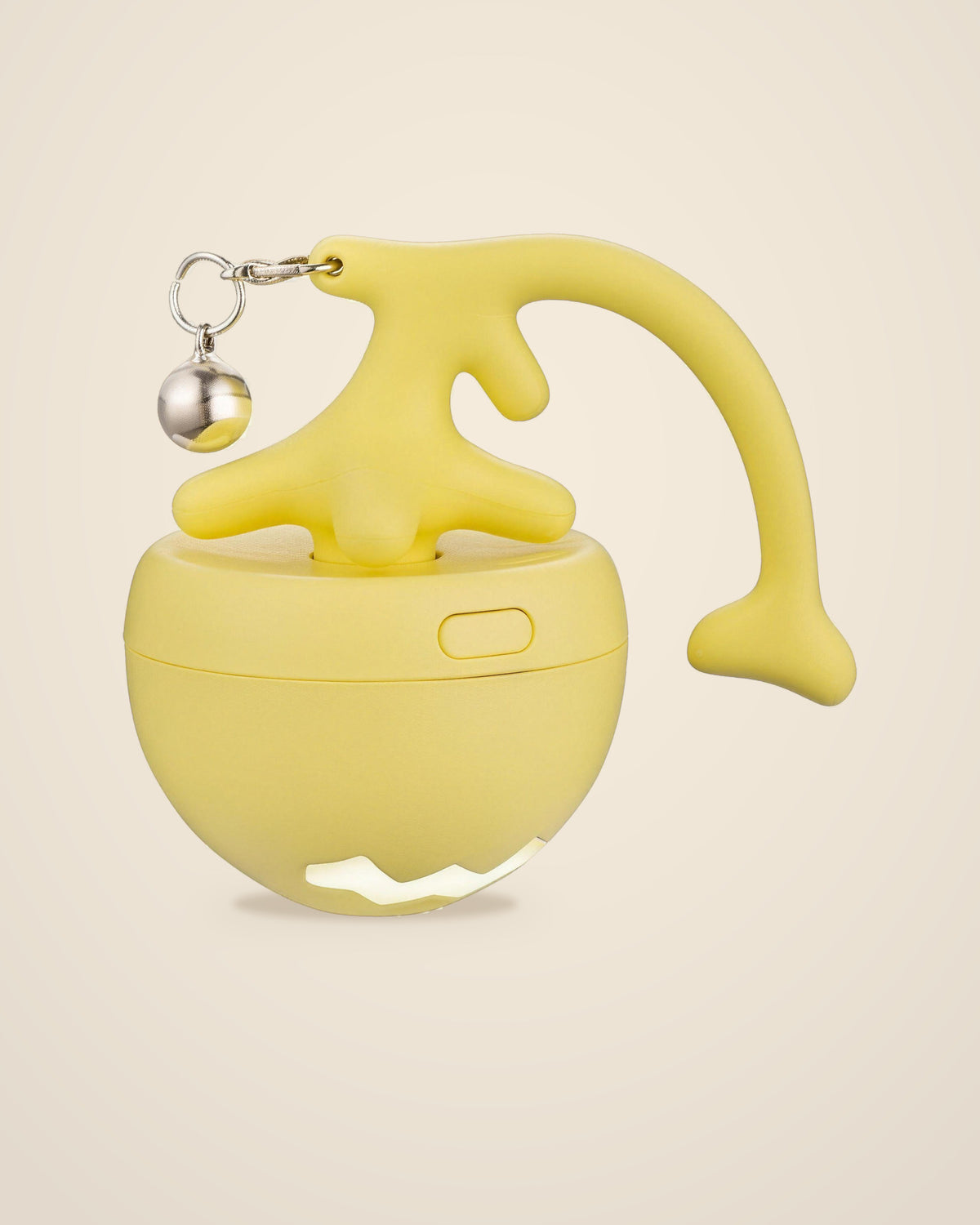 The DenKind Wonder Ball in yellow with its tail and bell